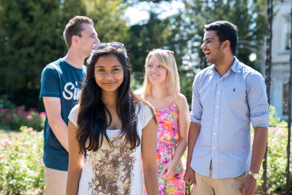 4 Roehampton international students smiling at camera